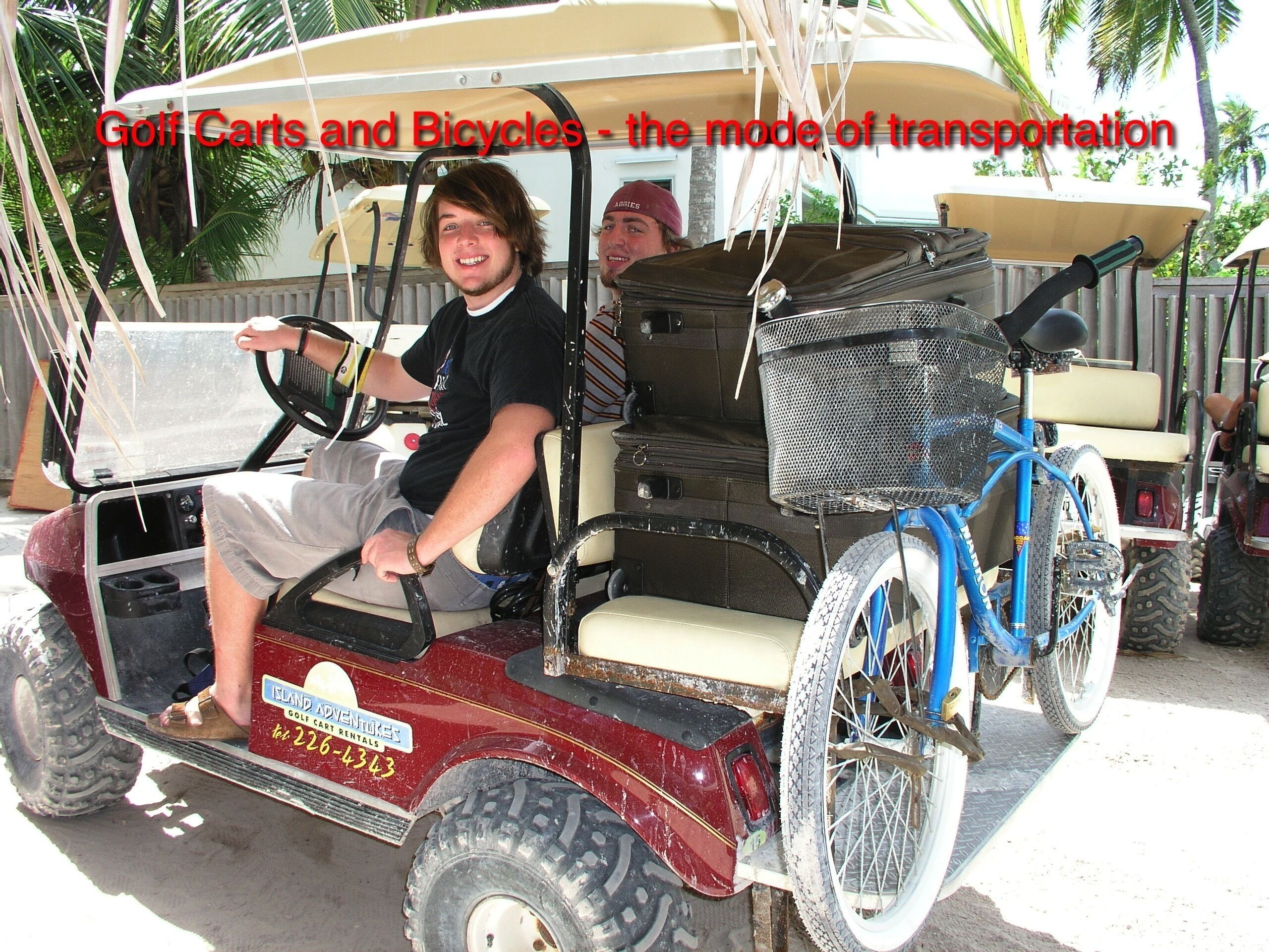 A golf cart with a blue bicycle attached to the back.