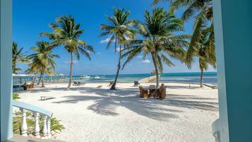 On the beach, sun-loungers, beach towels