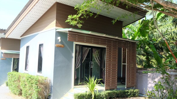 A modern two-story building with a flat roof, large windows, and a small front porch. - Numjaan Resort (Krabi)