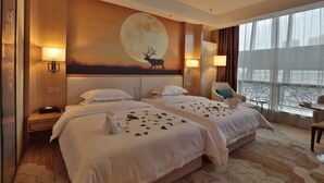 A hotel room with two beds, a large wall mural of a deer and moon, and a view of a cityscape through large windows. - Qinghai Baiyun Xiangling Hotel (Xining)