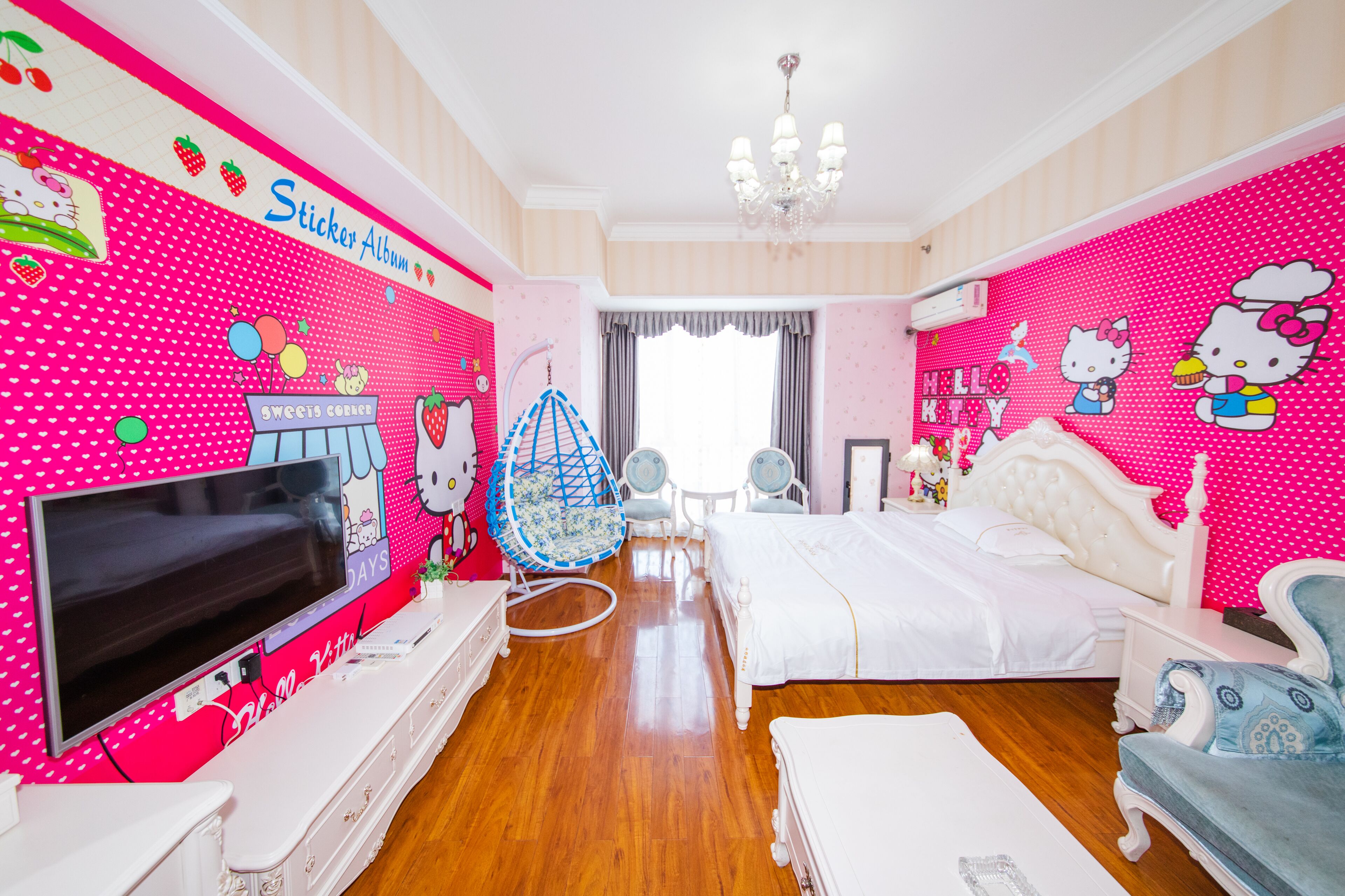 A pink-themed bedroom with a bed, a TV, a chair, and a dresser.