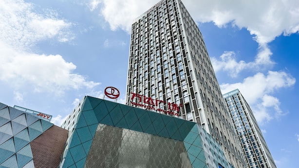 A high-rise building with a prominent sign. - Lavender Apartment -Wanda Branch (Guangzhou)