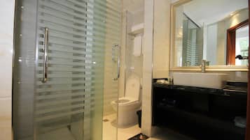 Shower, hair dryer, slippers, towels