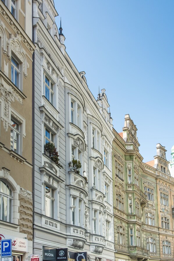 A row of historic buildings with ornate facades and multiple windows. - Decadent Art Deco Apartment in Old Town (Prague)