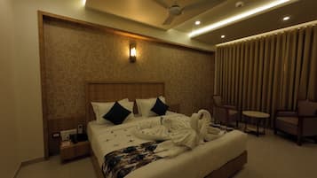 Premium bedding, desk, laptop workspace, blackout curtains