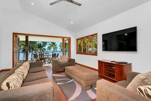 5 Bedroom Beachfront House | Living area | 55-inch flat-screen TV with cable channels, TV, DVD player