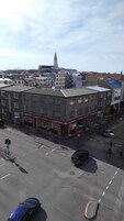 A multi-story building with a prominent sign for the Iceland Hotel.