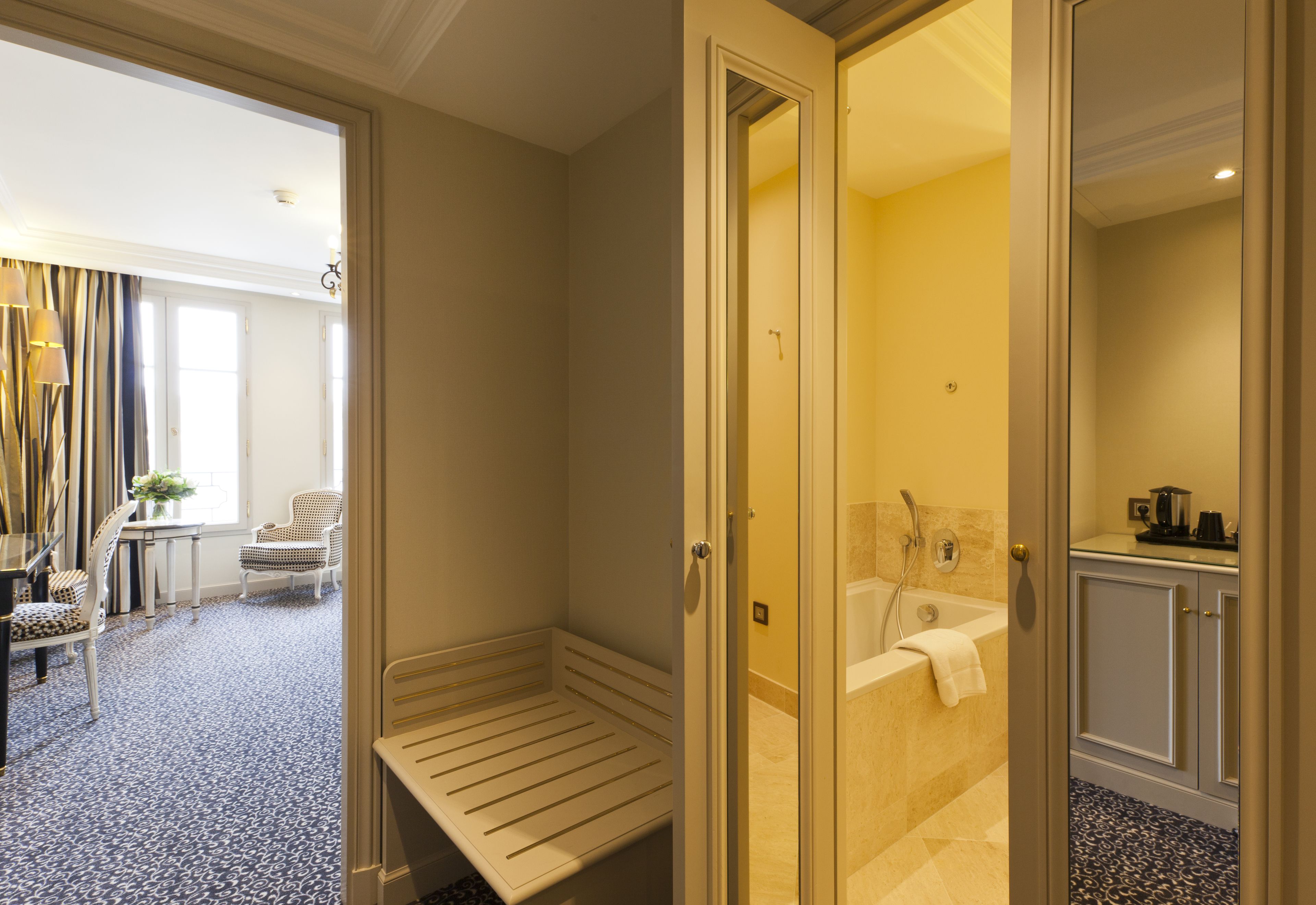 designer toiletries, hair dryer, bathrobes, slippers