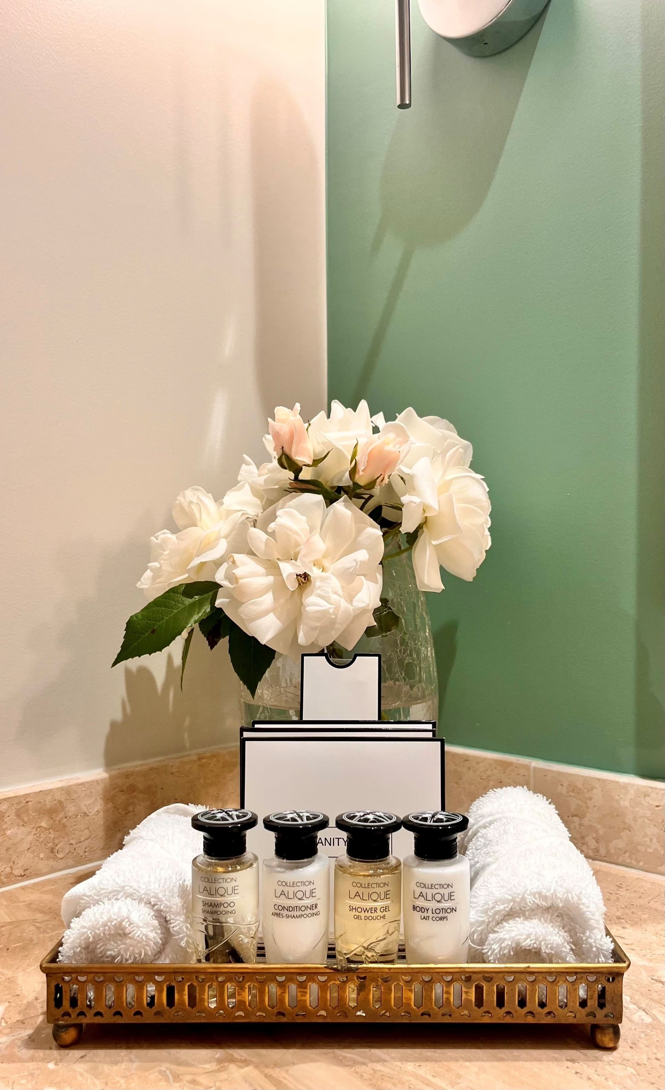 designer toiletries, hair dryer, bathrobes, slippers