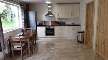 Apartment, 2 Bedrooms, Accessible, Garden View | Private kitchen | Fridge, microwave, oven, stovetop