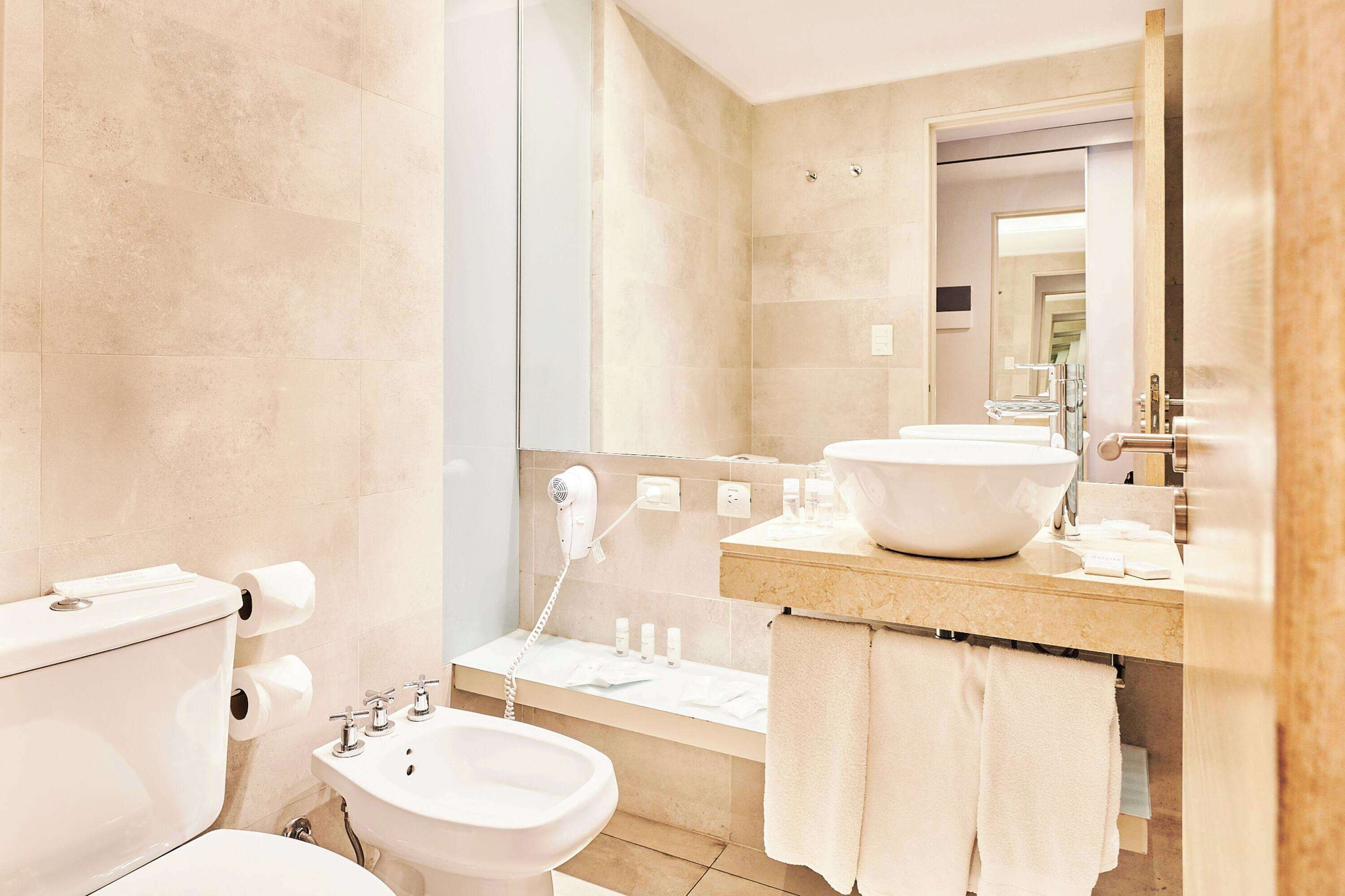 deep-soaking bathtub, free toiletries, hair dryer, towels