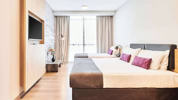 Classic Triple Room, 3 Single Beds | Minibar, in-room safe, desk, blackout curtains