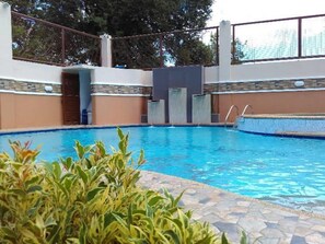 Outdoor pool, open 6 AM to midnight, free cabanas, pool umbrellas