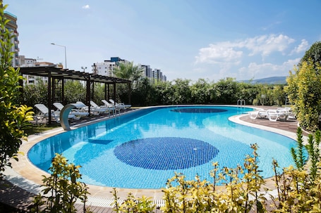 Outdoor pool, open 10:00 AM to 8:00 PM, pool umbrellas, sun loungers