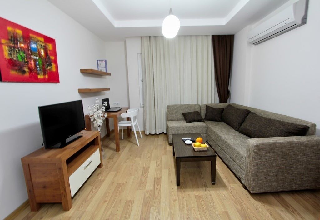 Basic Suite, 1 Bedroom | Living area | LCD TV