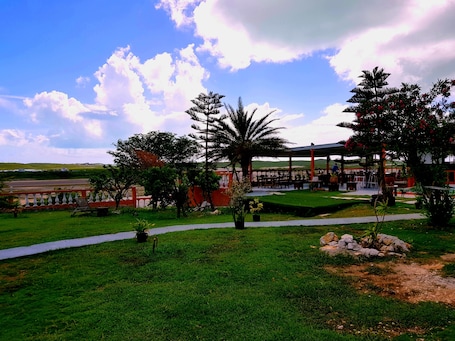 A park with a gazebo, seating areas, and a view of the landscape.