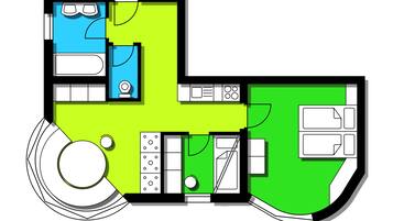 Plano de planta que muestra una cocina, comedor, sala de estar y un espacio circular para sentarse.