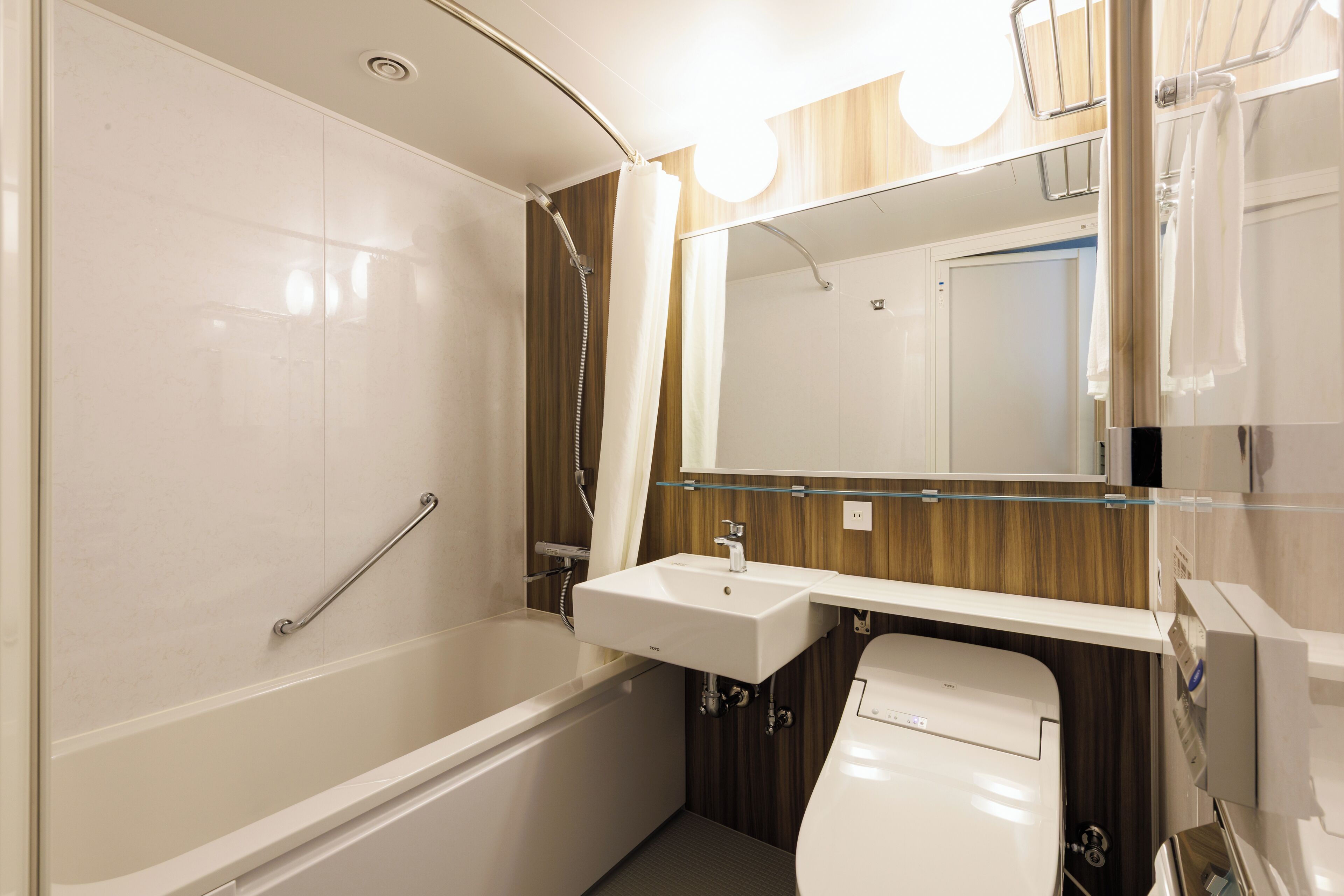 hair dryer, slippers, electronic bidet, towels