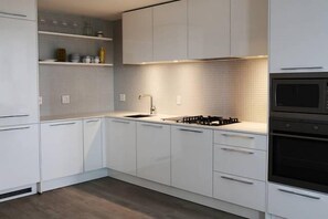 Condo, 2 Bedrooms, Kitchen | Private kitchen | Full-size fridge, microwave, oven, stovetop - Mark On 10th by Short Term Stays (Calgary)