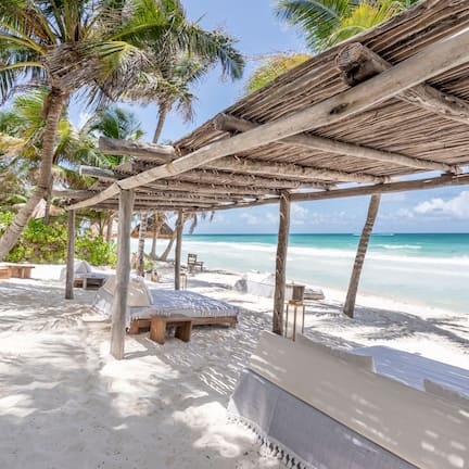 Private beach, white sand, sun loungers, beach umbrellas