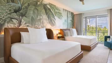 A hotel room with two beds, a ceiling fan, a large window with a view of palm trees, and a tropical mural on the wall.
