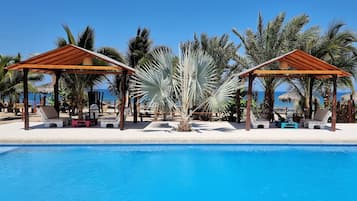 Outdoor pool, open 8:00 AM to 11:00 PM, free cabanas, pool umbrellas