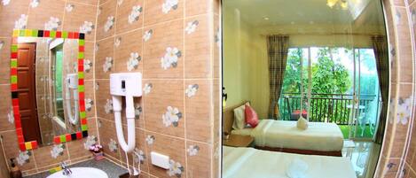 A bathroom with a sink, mirror, and shower.