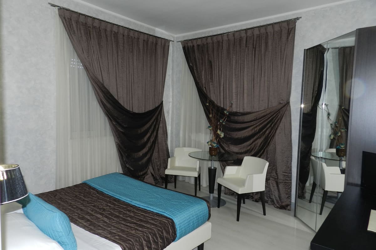 deluxe double room | in-room safe, desk, blackout curtains, soundproofing