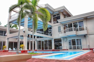 Outdoor pool, open 9:00 AM to 10 PM, pool umbrellas, sun loungers