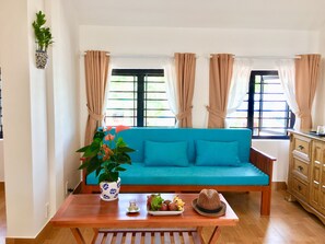 Junior Suite | Living area | LCD TV - Ravenala Boutique Resort (Phan Thiet)