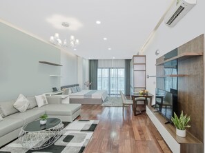 Monolocale | Area soggiorno | TV a schermo piatto