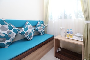 Deluxe-Doppelzimmer | Wohnbereich | LCD-Fernseher
