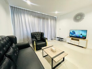 Habitación cuádruple familiar | Zona de estar