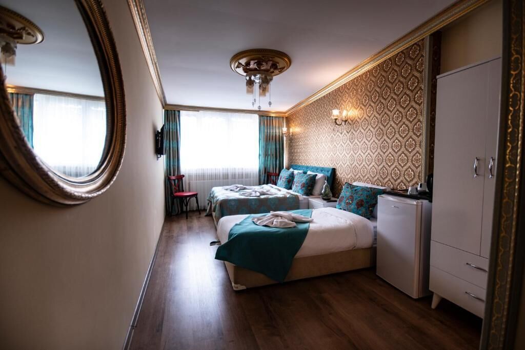 Superior driepersoonskamer | Luxe beddengoed, een kluis op de kamer, geluiddichte muren