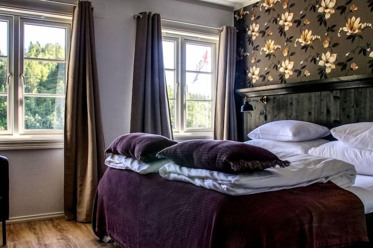 Pillowtop beds, desk, laptop workspace, iron/ironing board (on request)