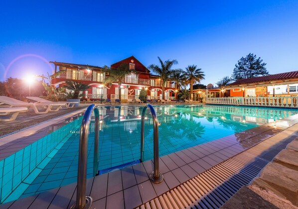 Seasonal outdoor pool, pool umbrellas, pool loungers