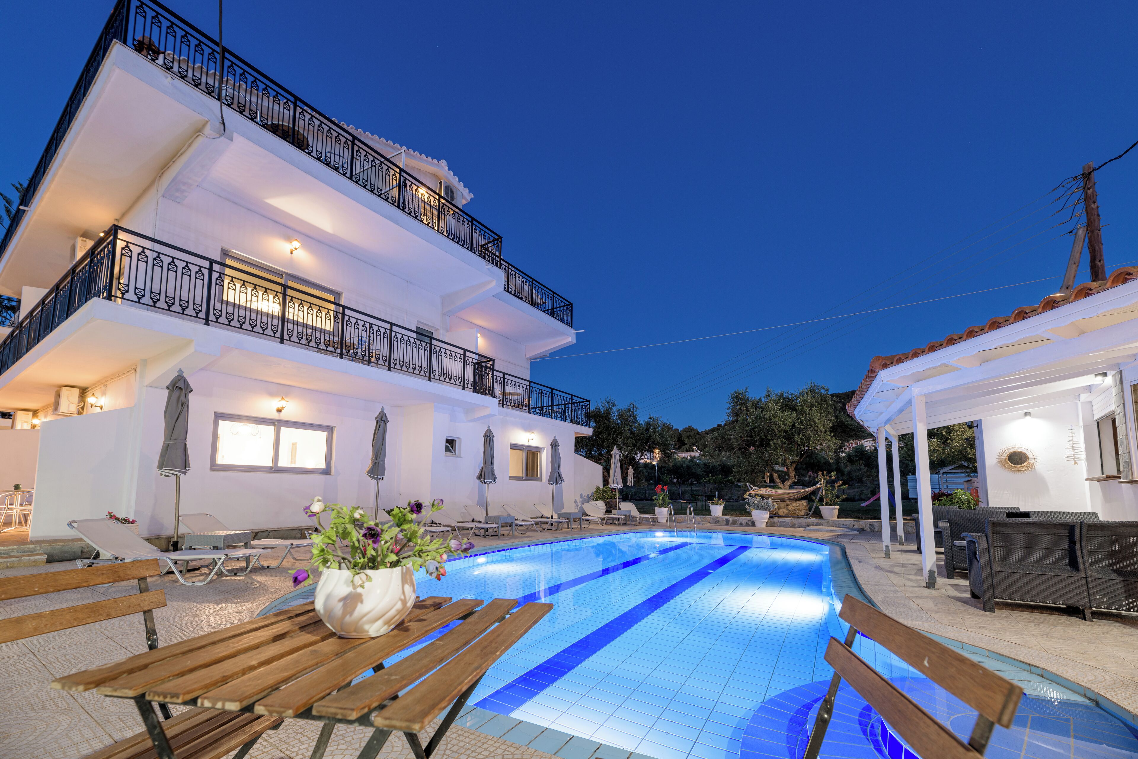 seasonal outdoor pool, open 9:00 am to 8:00 pm, pool umbrellas