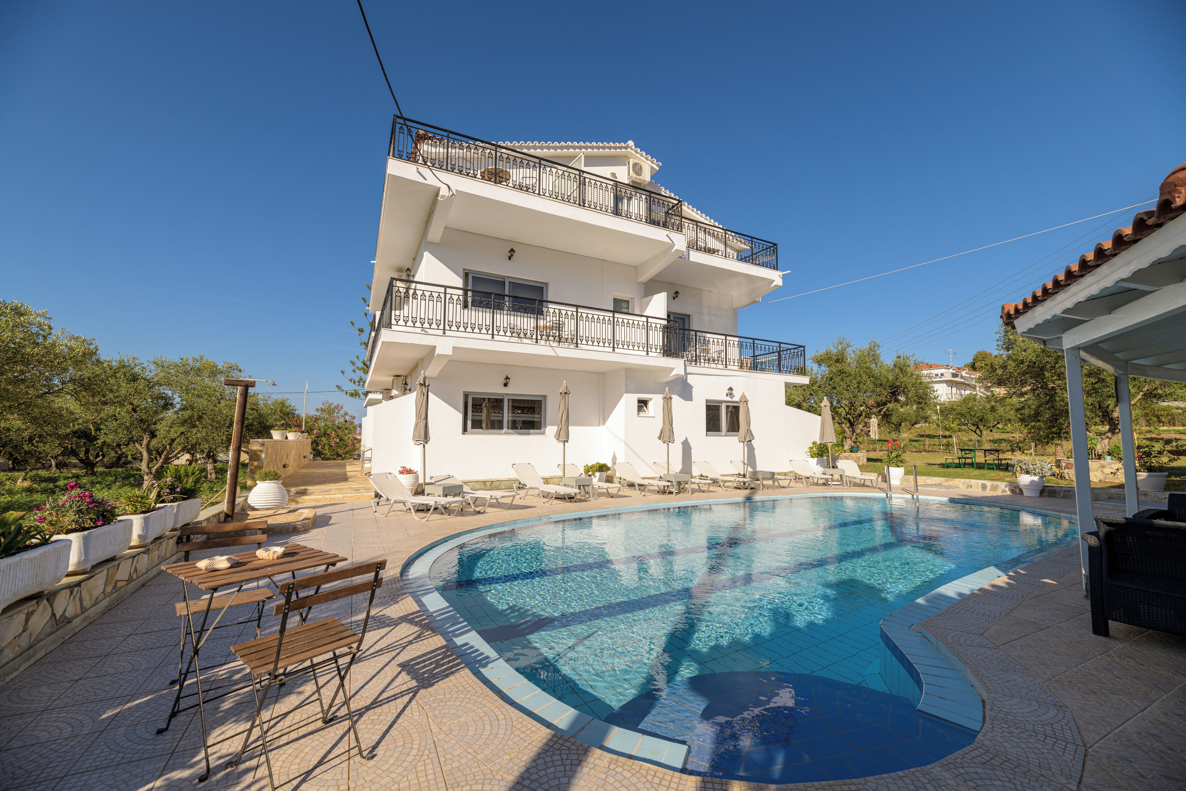 seasonal outdoor pool, open 9:00 am to 8:00 pm, pool umbrellas