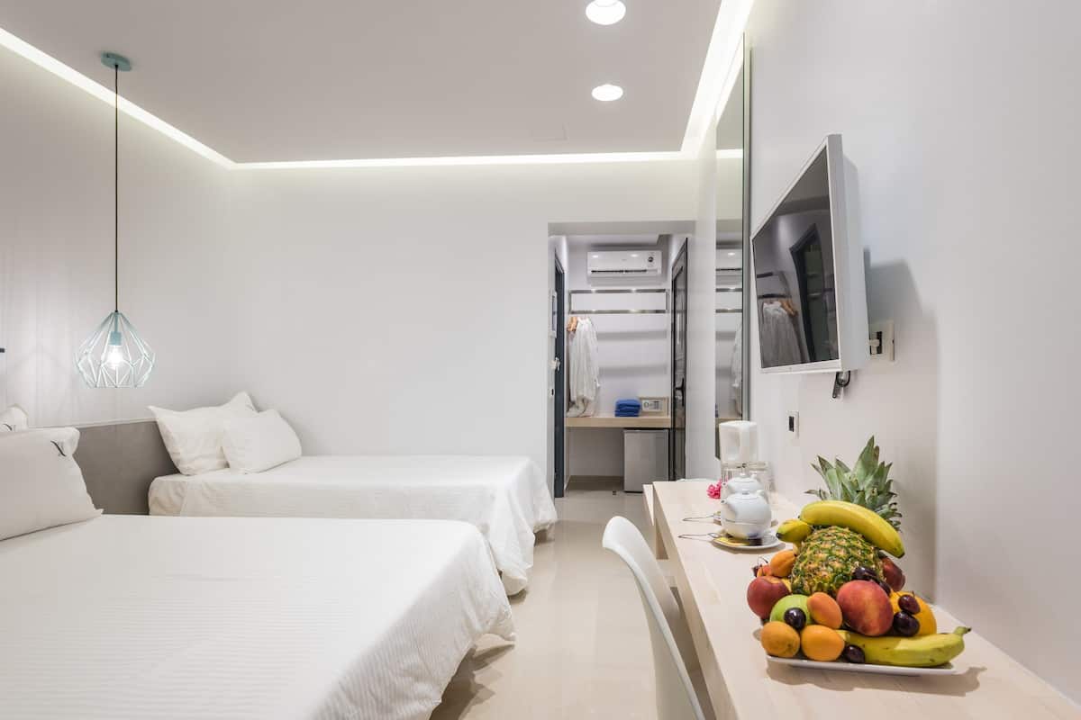 deluxe triple room | in-room safe, iron/ironing board, free wifi, bed sheets