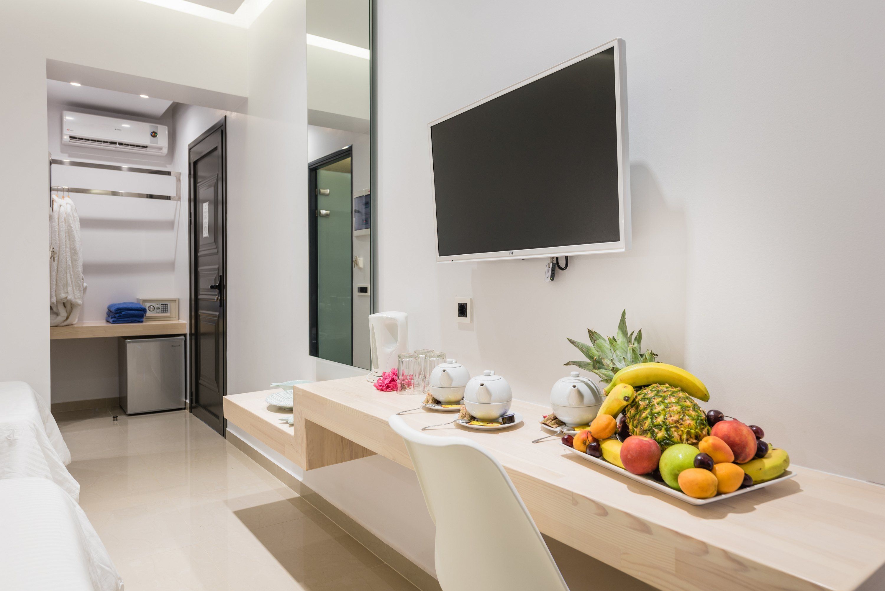 deluxe triple room | living area | smart tv