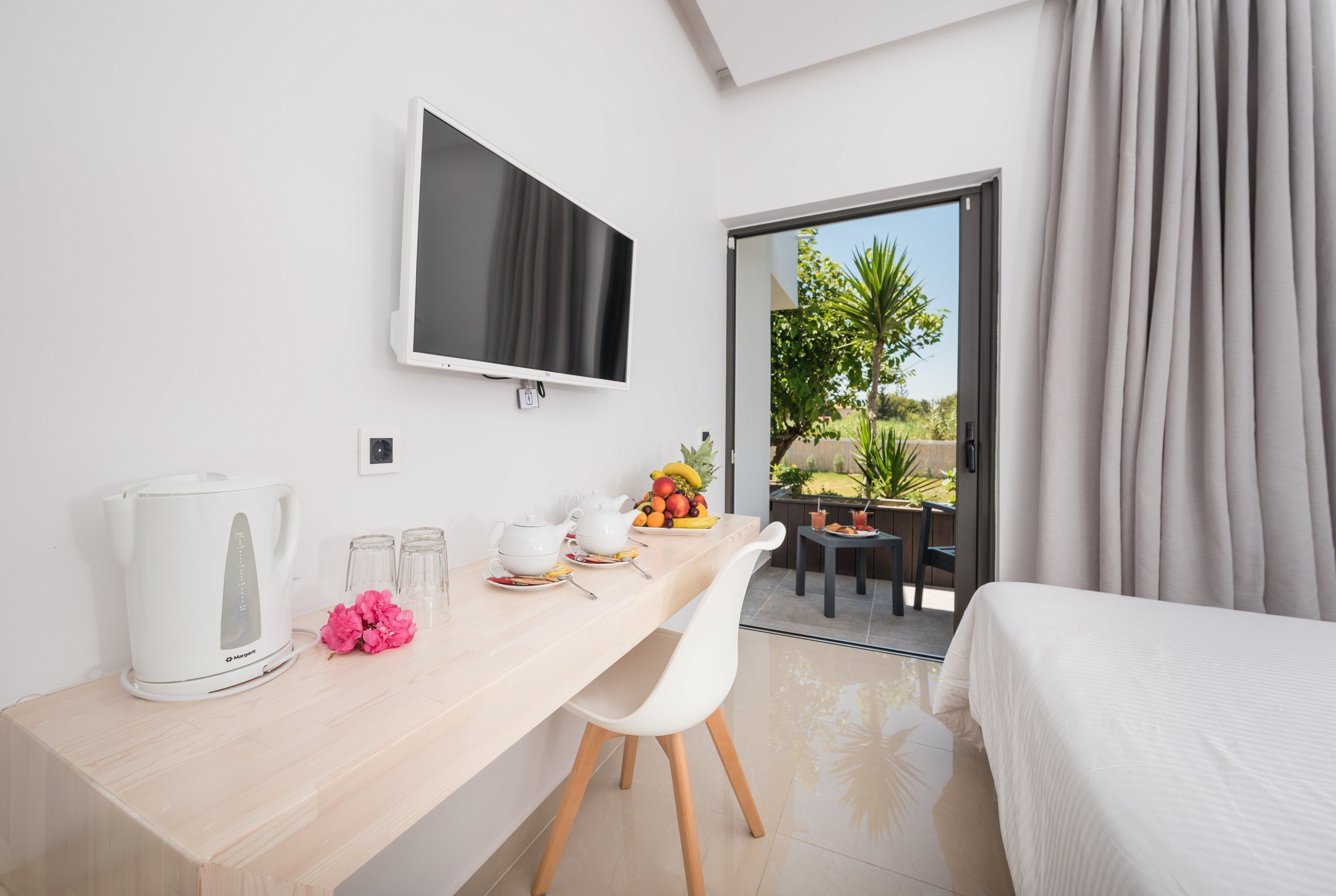 deluxe triple room | living area | smart tv