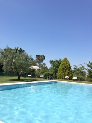 Seasonal outdoor pool, pool umbrellas, pool loungers