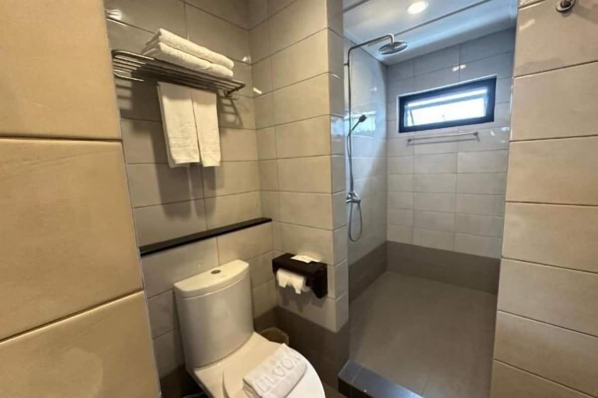 Shower, free toiletries, hair dryer, slippers