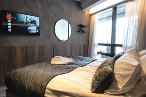 Premium bedding, pillowtop beds, blackout drapes, free WiFi