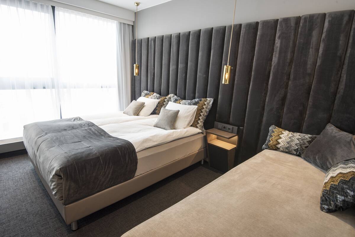 Premium bedding, pillowtop beds, blackout drapes, WiFi (free)