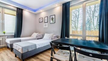 Deluxe-Apartment | Wohnbereich | Flachbildfernseher