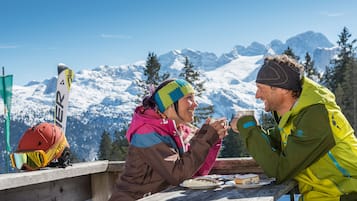 Guests can enjoy casual dining with a view of the surrounding mountains.