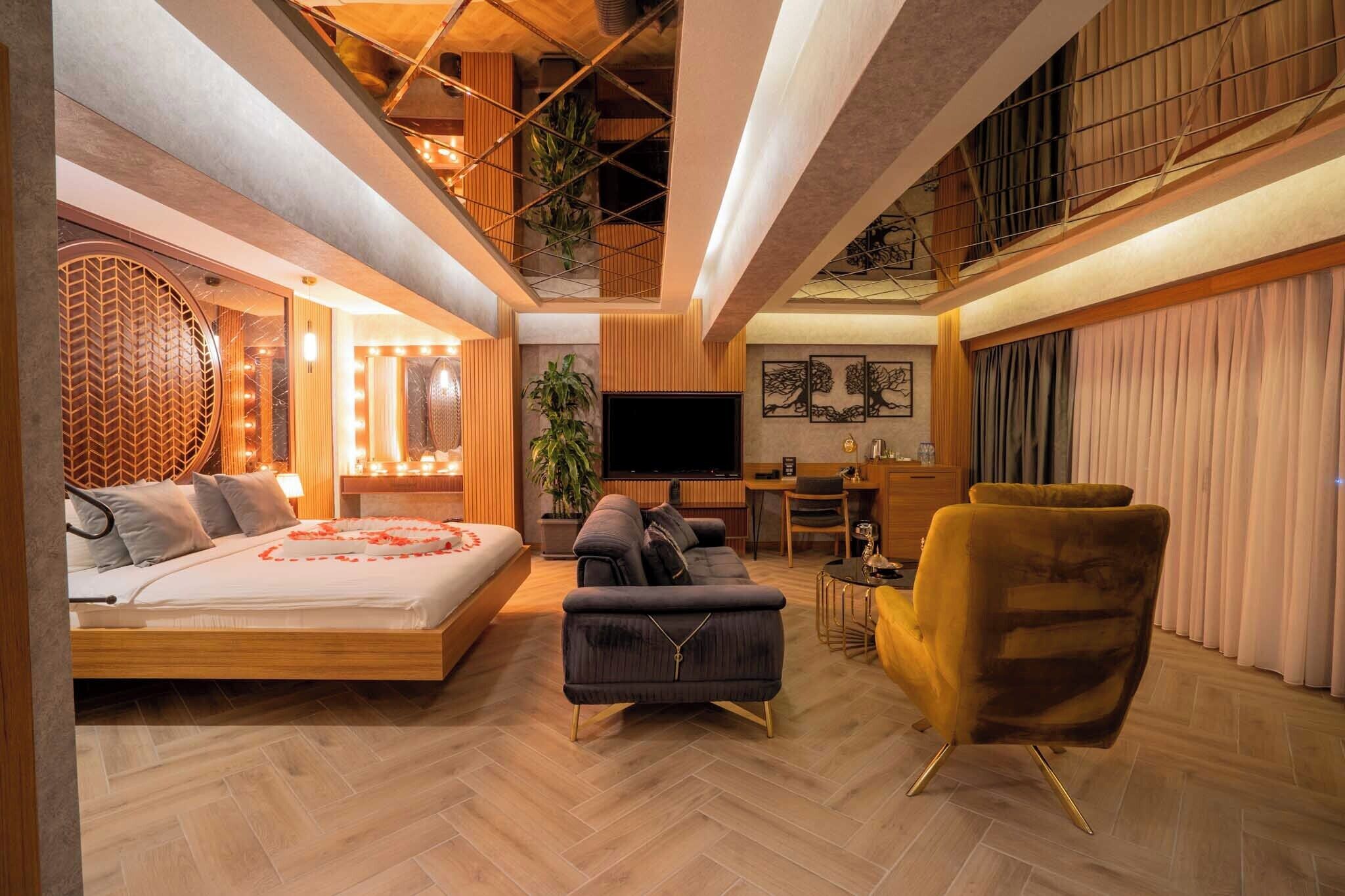 Suíte luxo, banheira de hidromassagem | Frigobar, cofres nos quartos, escrivaninha, quartos à prova de som