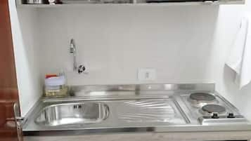 Fridge, microwave, stovetop, cookware/dishes/utensils