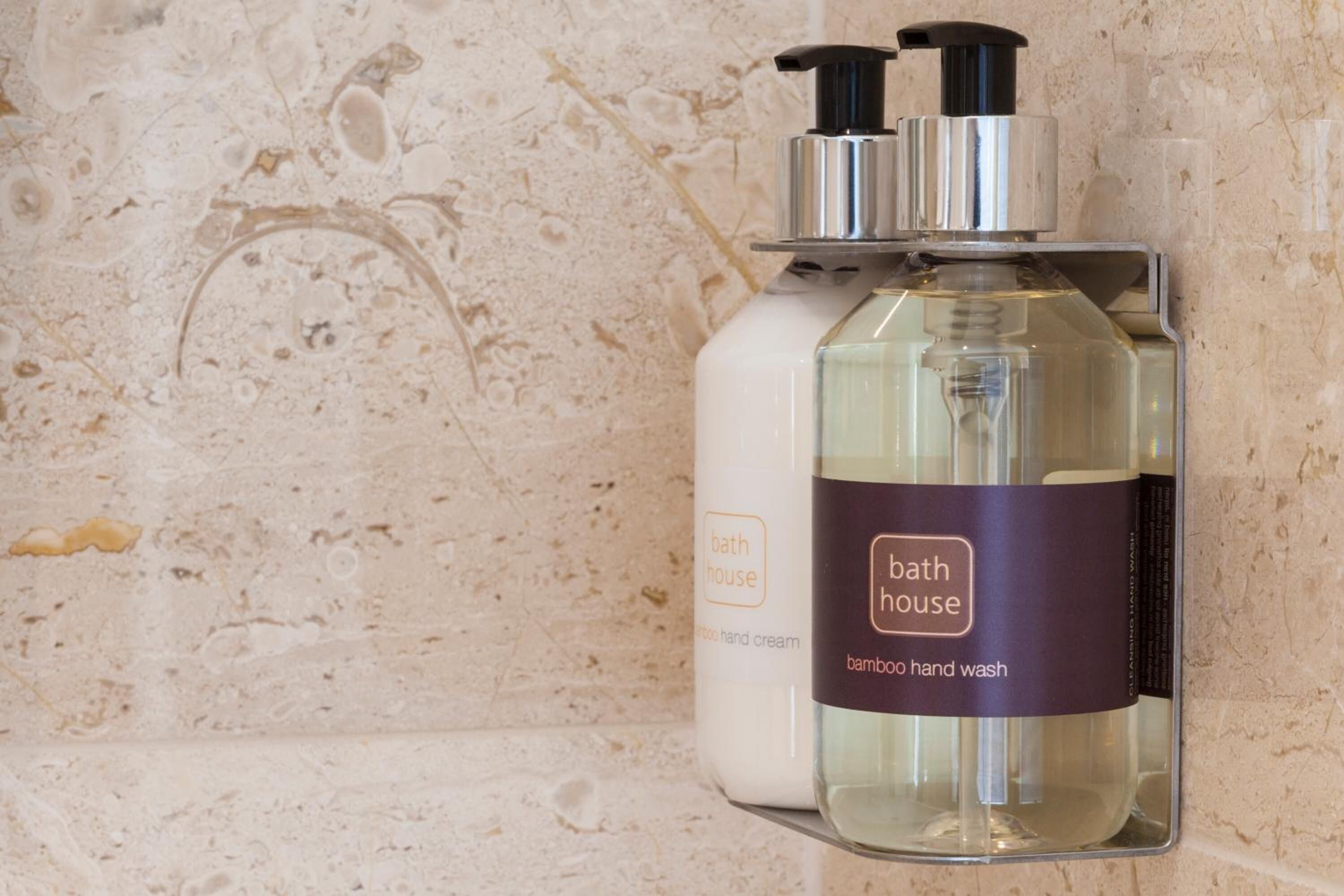 shower, designer toiletries, hair dryer, towels